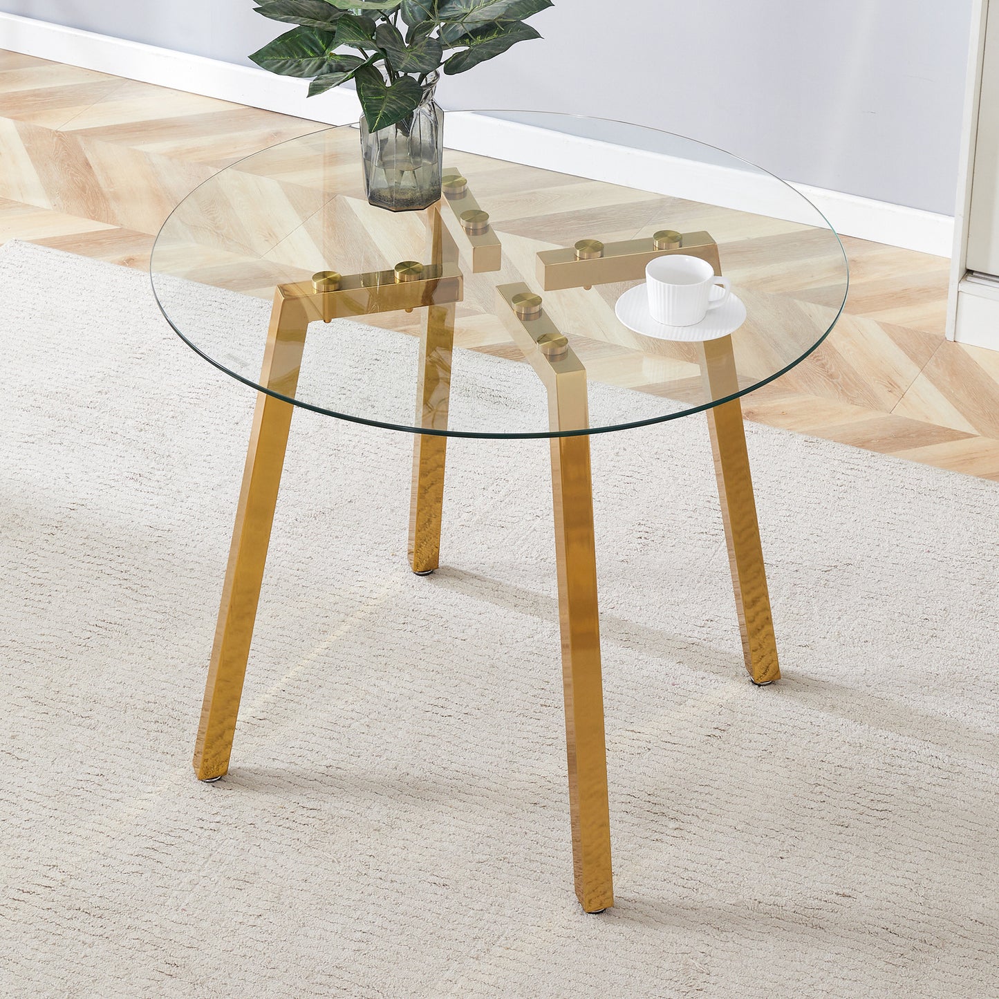 Modern Luxurious Round Tempered Glass Dining Table with Gold 7-Shaped Metal Legs,suitable for family meals, office conferences, or as a casual coffee table for various occasions.36*36*29.5