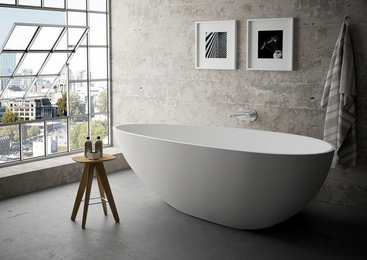 67 x 33.5 x 20 Inch Solid Surface Freestanding Oval Soaking Bathtub in Matte White with Drain